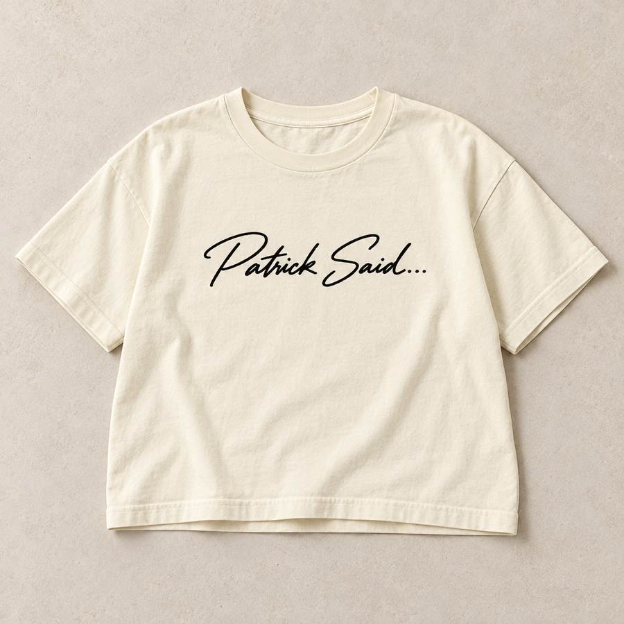 Proposed Patrick Said wordmark on an Ivory boxy women’s tee